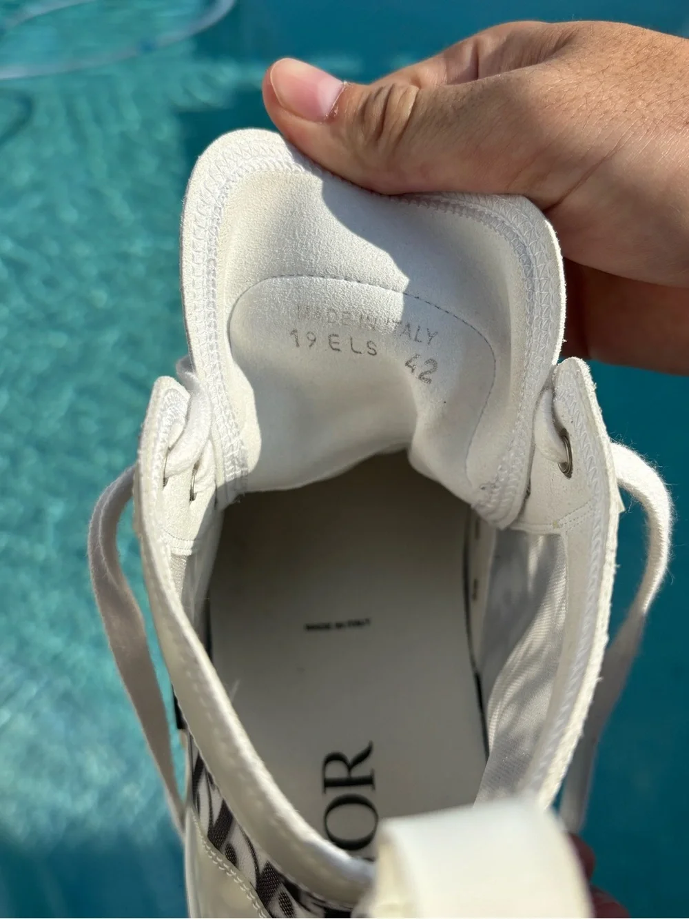Dior High-Top Sneaker in White and Light Gray. Fits size 8.5/9. Worn once.